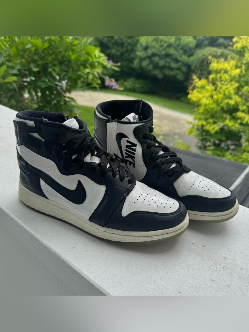 Nike Black and White Mid-Top Sneakers